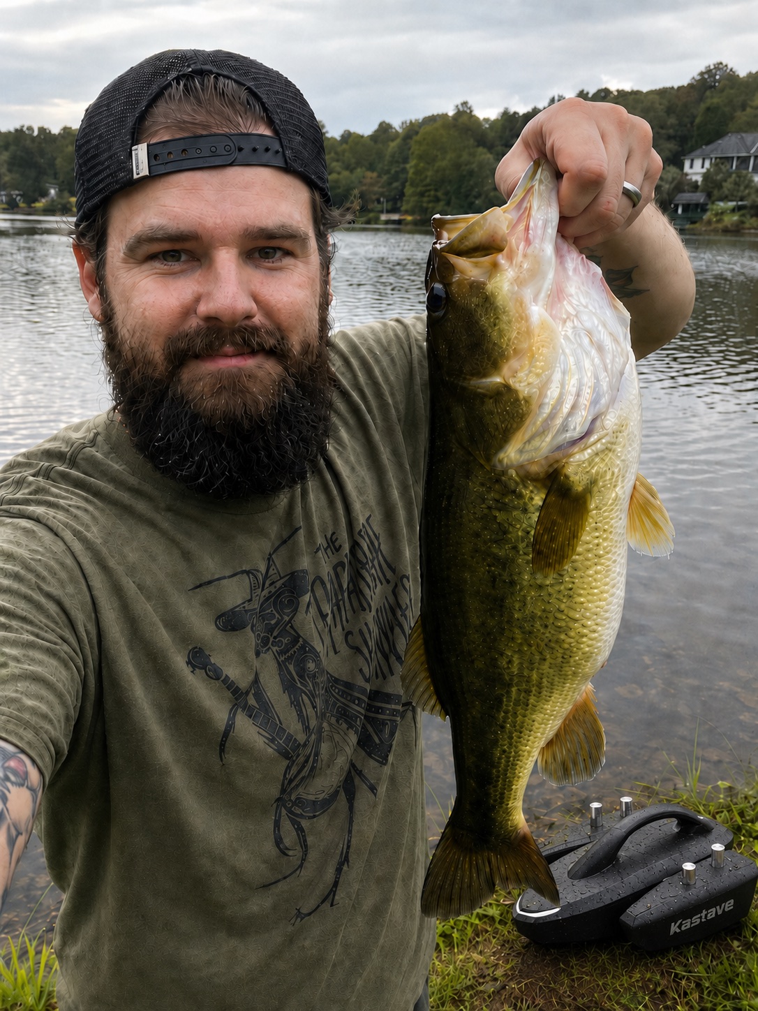 Early tester holding a largemouth bass near Kastave